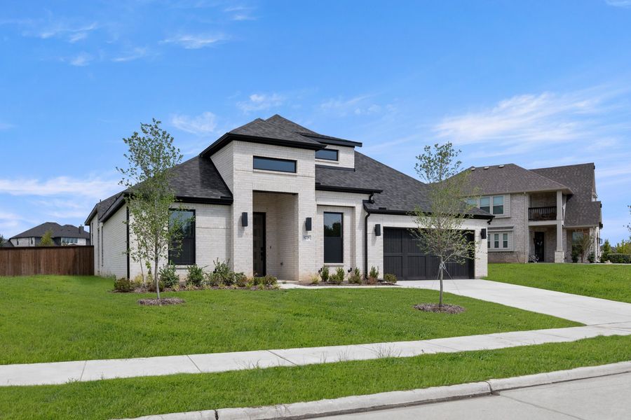 Front exterior of a new home in Hayes Crossing, Midlothian, TX, highlighting curb appeal (Image 2).