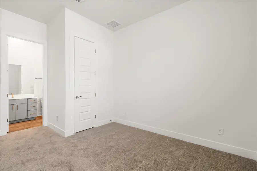 A spacious bedroom provides a blank canvas, offering ample room for personalization and comfort. A spacious bedroom provides a blank canvas, offering ample room for personalization and comfort.