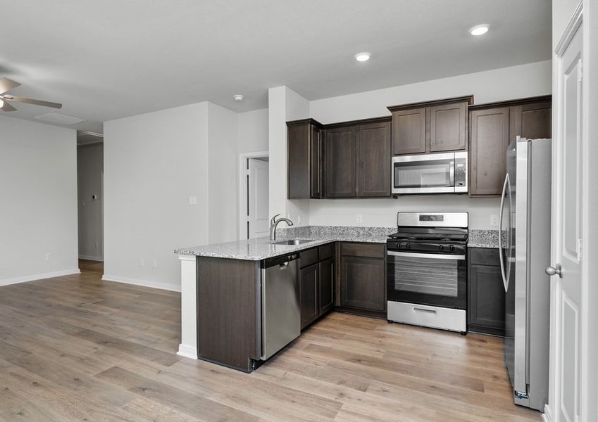 The kitchen has sprawling granite countertops.