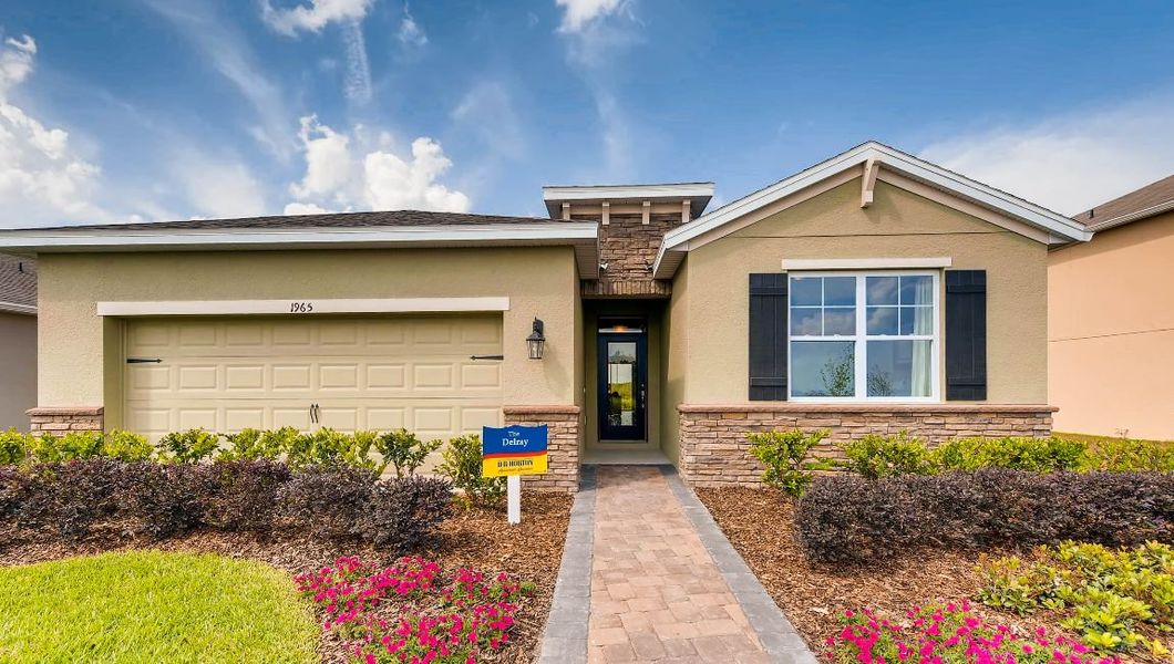 Front exterior of a home in the Preserves at Lakeside Landings community, located in Winter Haven, FL (Image 8).