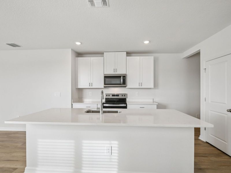 Furnished interior view inside a new home in The Grove at Stuart Crossing - Premier Series, Bartow (Image 3). Furnished interior view inside a new home in The Grove at Stuart Crossing - Premier Series, Bartow (Image 3).