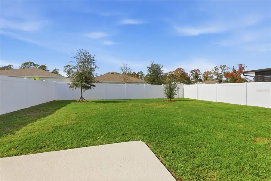 Exterior details and patio area of a home in Vineland Reserve, Osteen (Image 3).