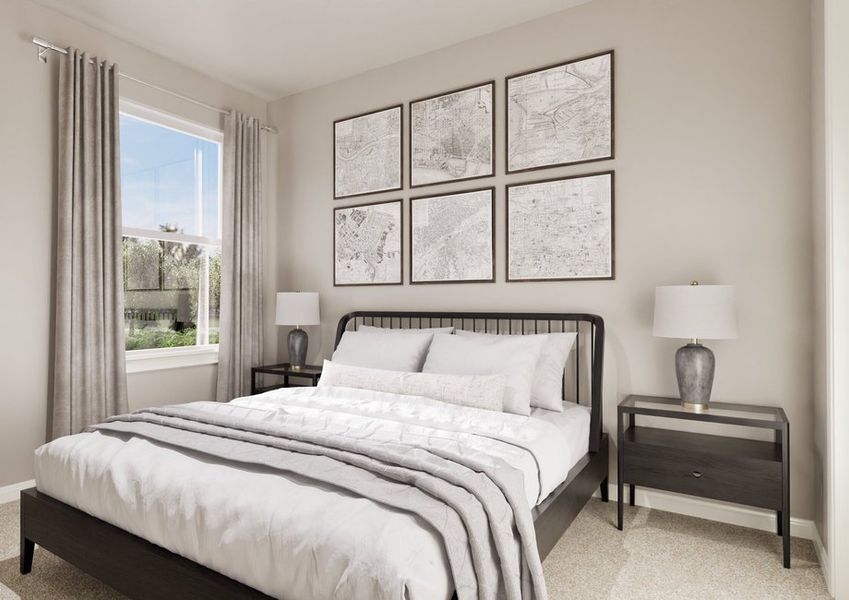 Cozy bedroom featuring a black bed frame, light gray blankets, framed maps on the wall, and a bedside lamp by a large window.