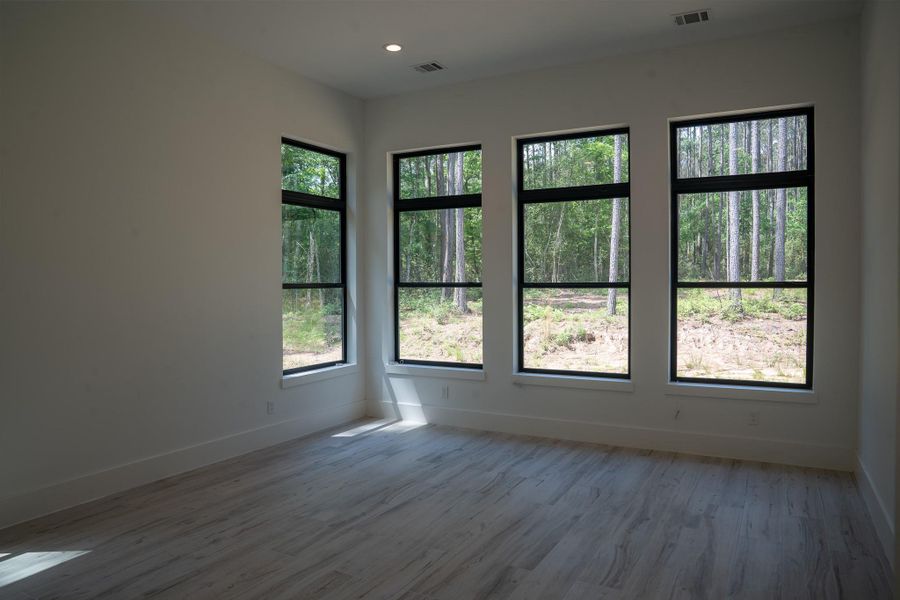 Another view of the primary bedroom.