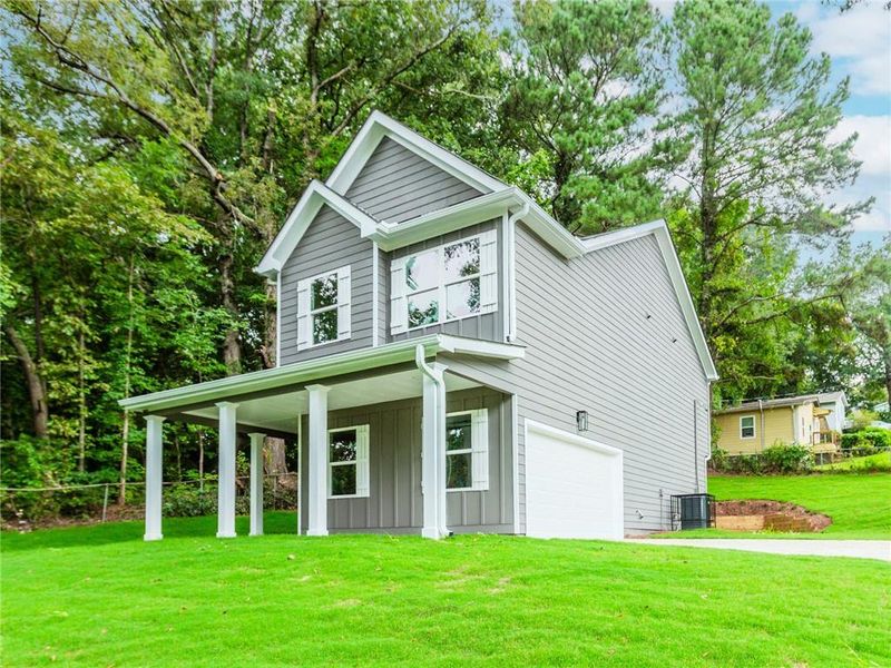 Front exterior of a new home in , Atlanta, GA, highlighting curb appeal (Image 14).