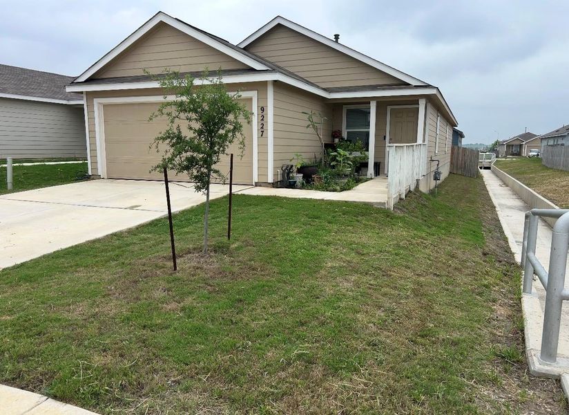 Front exterior of a new home in Navarro Ranch, Seguin, TX, highlighting curb appeal (Image 1). Front exterior of a new home in Navarro Ranch, Seguin, TX, highlighting curb appeal (Image 1).