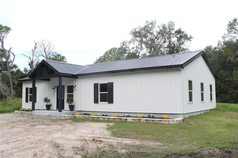 Front exterior of a new home in , Parrish, FL, highlighting curb appeal (Image 1). Front exterior of a new home in , Parrish, FL, highlighting curb appeal (Image 1).