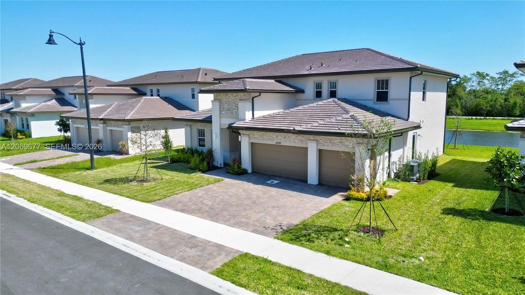 Front exterior of a new home in , Davie, FL, highlighting curb appeal (Image 24). Front exterior of a new home in , Davie, FL, highlighting curb appeal (Image 24).