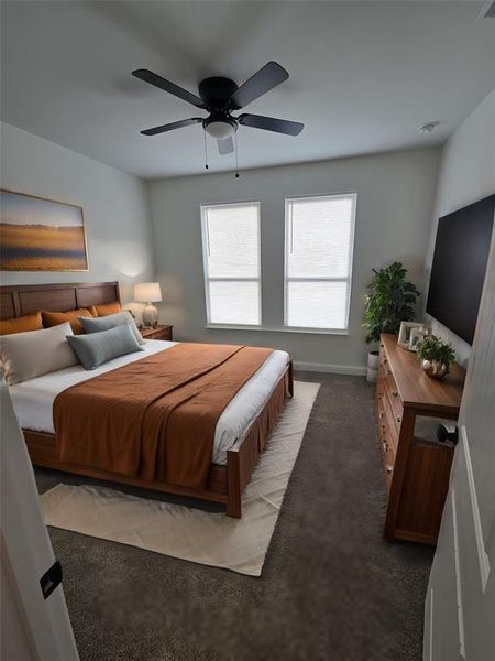 Bedroom with ceiling fan and carpet floors