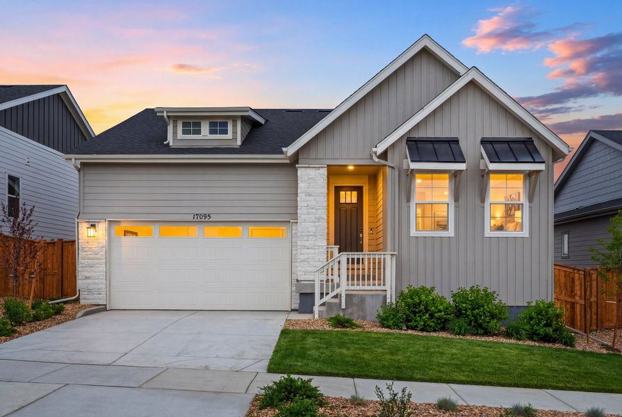 Front exterior of a new home in Trailstone, Arvada, CO, highlighting curb appeal (Image 1). Front exterior of a new home in Trailstone, Arvada, CO, highlighting curb appeal (Image 1).