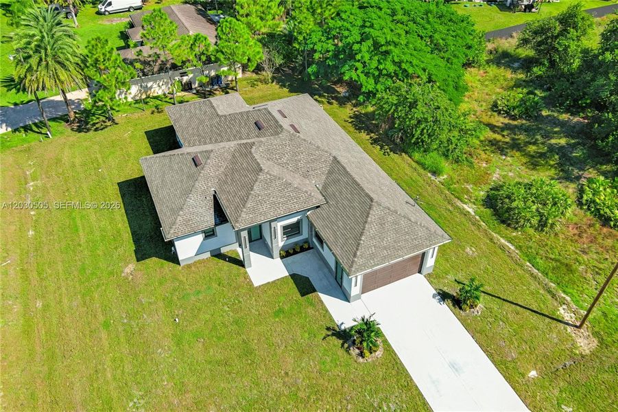 Front exterior of a new home in , Lehigh Acres, FL, highlighting curb appeal (Image 24). Front exterior of a new home in , Lehigh Acres, FL, highlighting curb appeal (Image 24).
