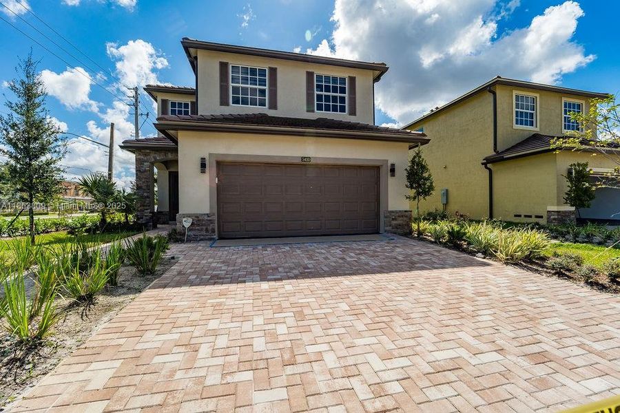 Front exterior of a new home in , Tamarac, FL, highlighting curb appeal (Image 18).