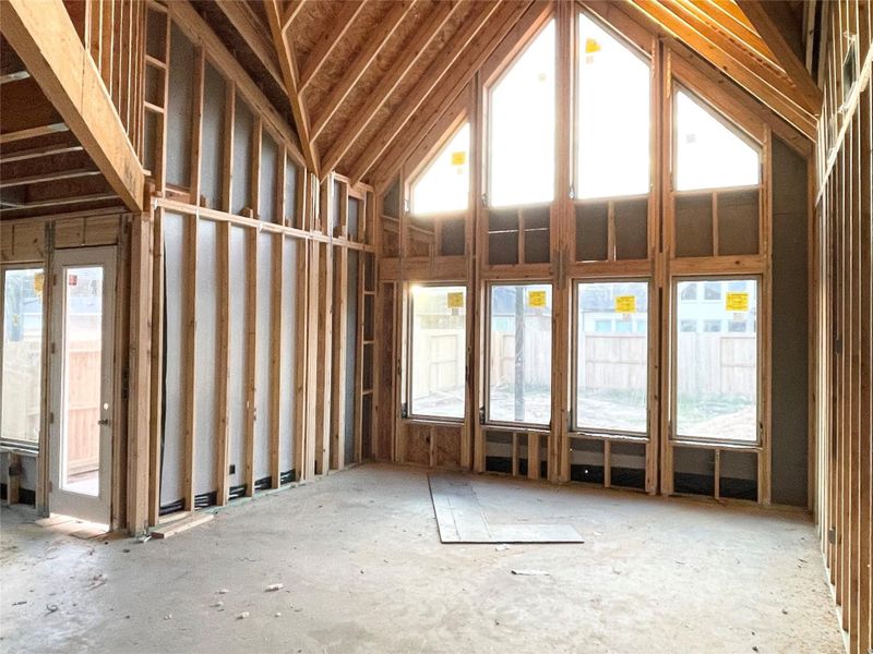 High Ceiling Family Room With Straigh Lines & Arcitectual Charm