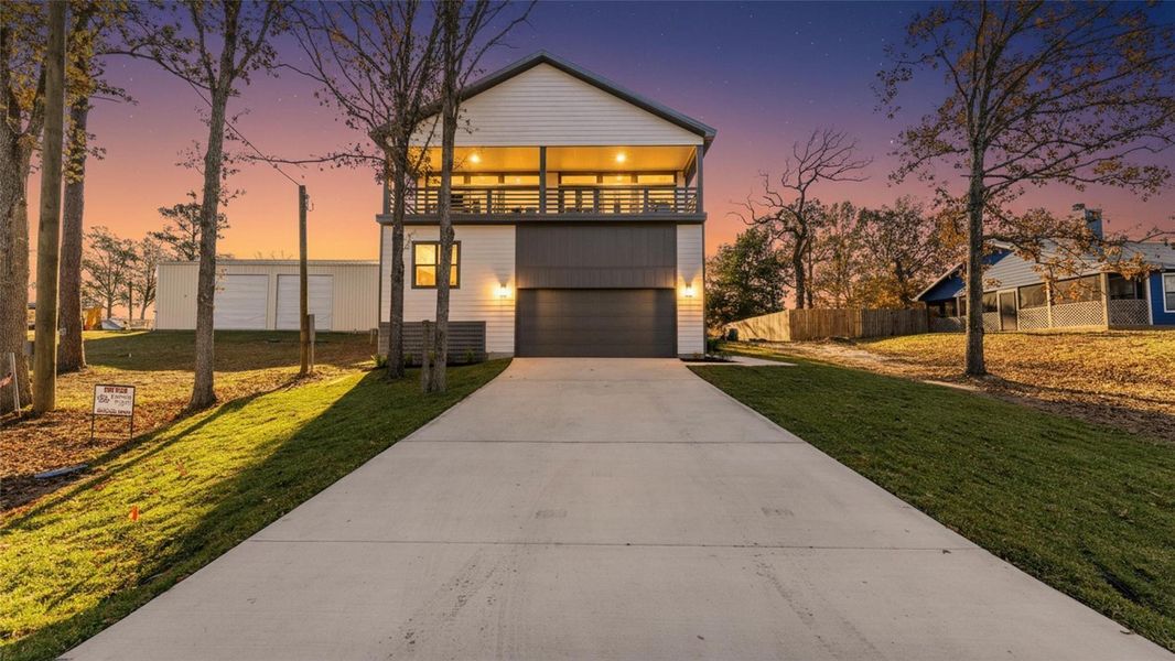 Front exterior of a new home in , Livingston, TX, highlighting curb appeal (Image 27).