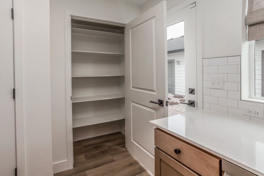 Representative furnished interior of a home built from the Magnolia by Hartford Homes in Prairie Song, Windsor (Image 31).