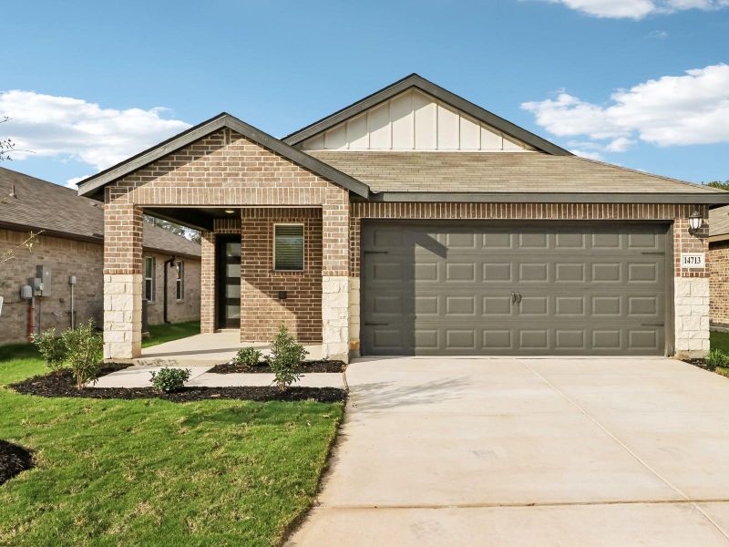 View of front facade featuring brick siding, an attached garage, and driveway View of front facade featuring brick siding, an attached garage, and driveway