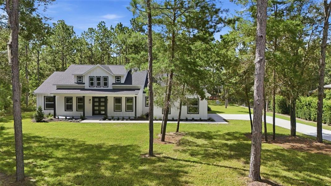 Front exterior of a new home in , Wildwood, FL, highlighting curb appeal (Image 25).