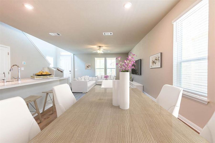 Virtually staged Dining area thru to kitchen and living room.