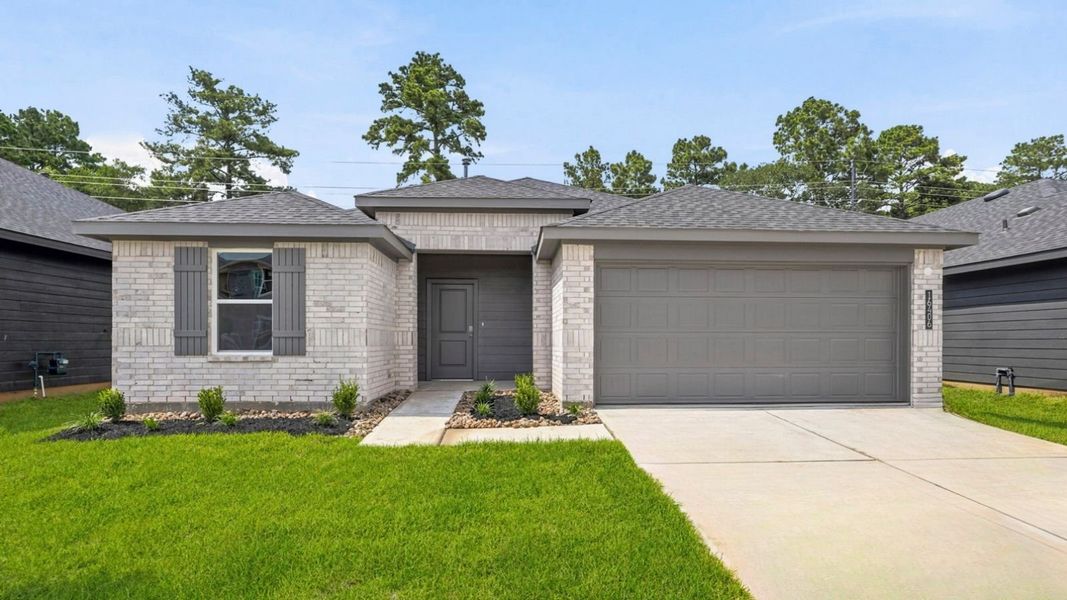 Front exterior of a new home in Grand Pines, Magnolia, TX, highlighting curb appeal (Image 1). Front exterior of a new home in Grand Pines, Magnolia, TX, highlighting curb appeal (Image 1).