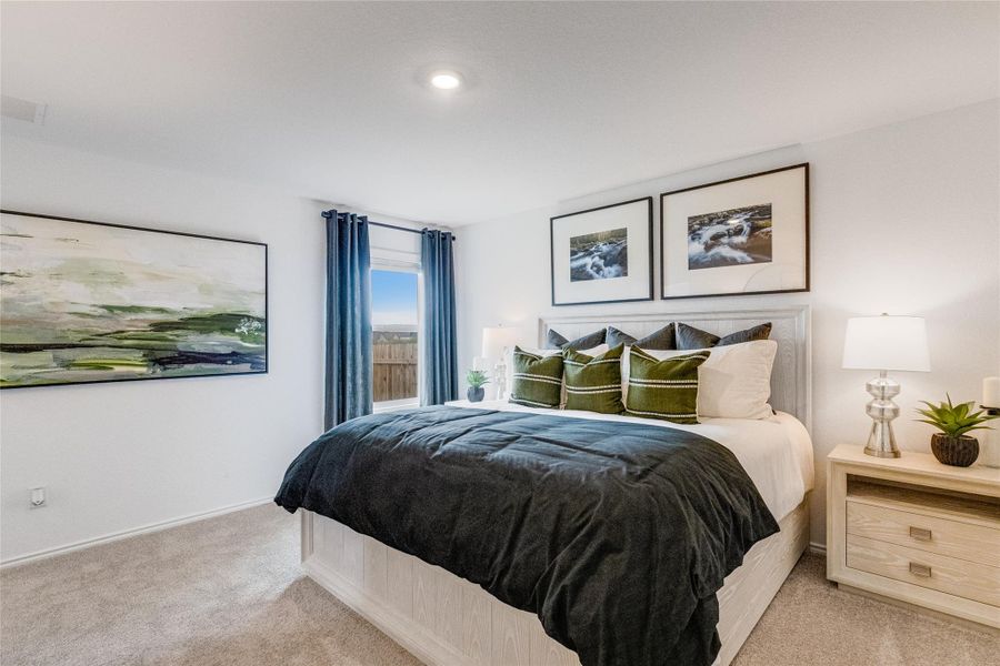 Bedroom with carpet and baseboards Bedroom with carpet and baseboards