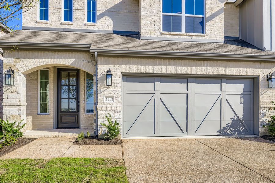 Exterior details and patio area of a home in Castle Hills Northpointe - Townhomes, Carrollton (Image 2). Exterior details and patio area of a home in Castle Hills Northpointe - Townhomes, Carrollton (Image 2).