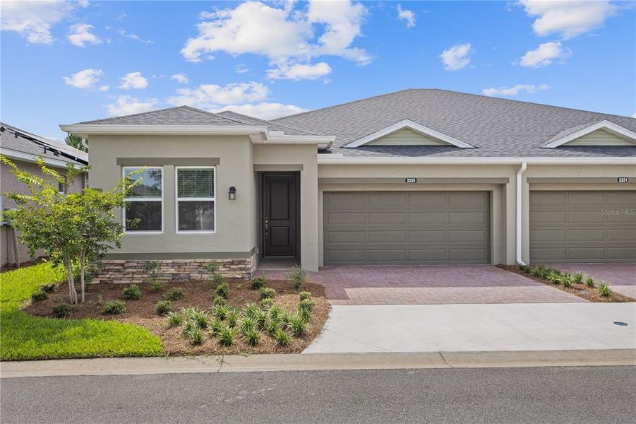 Front exterior of a new home in , Ocala, FL, highlighting curb appeal (Image 1).