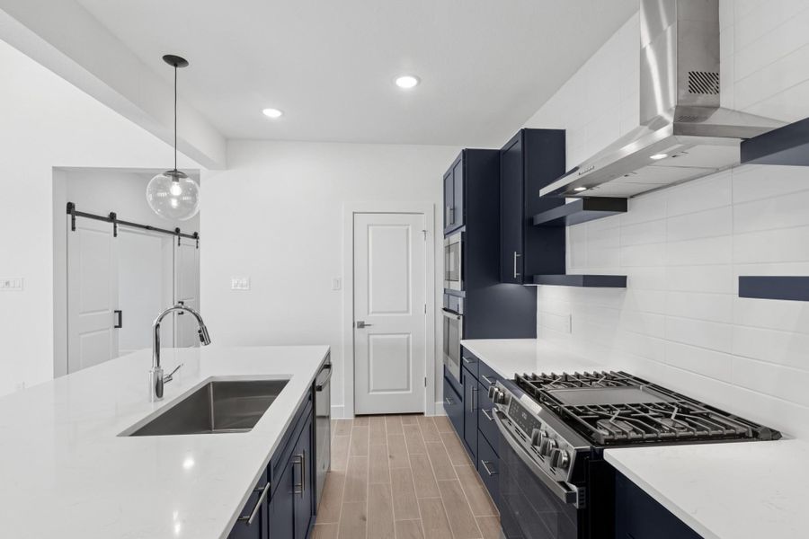 Gorgeous kitchen with blue cabinets and quartz countertops Gorgeous kitchen with blue cabinets and quartz countertops