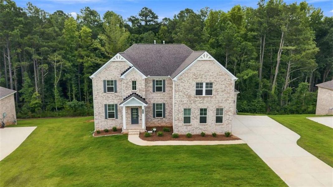 Front exterior of a new home in Trinity Park, McDonough, GA, highlighting curb appeal (Image 33).