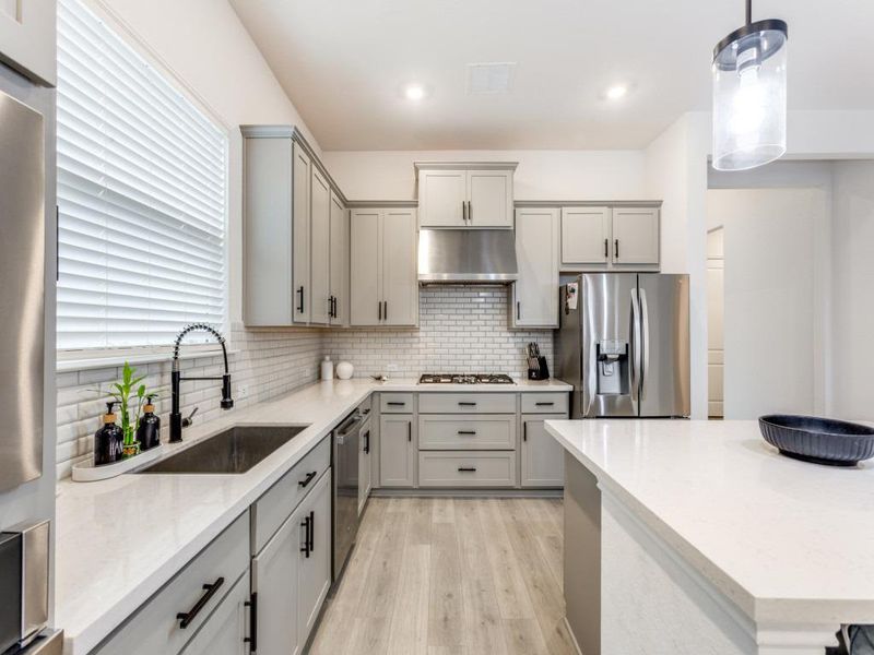 The kitchen vibe is clean, soft, and easy to style.