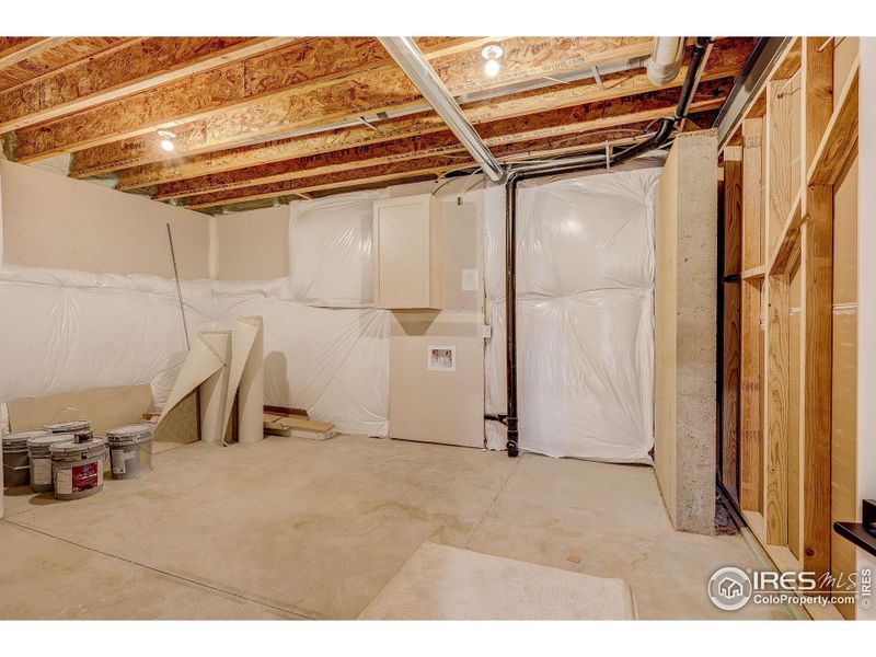 Storage space with extra washer dryer hook ups in basement