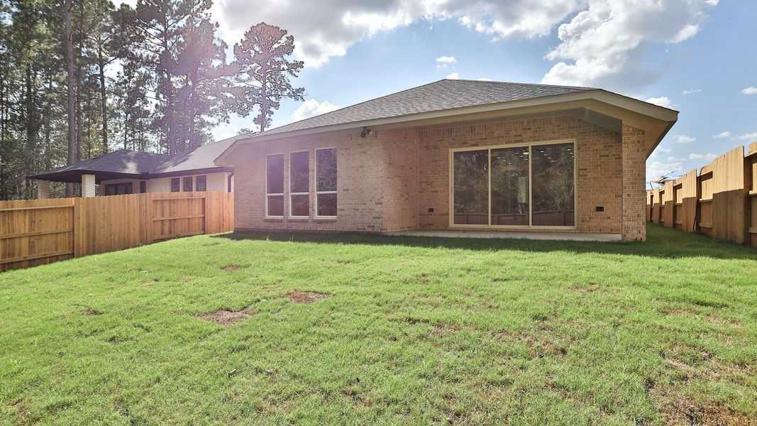 Exterior details and patio area of a home in Woodhavyn, Magnolia (Image 3).