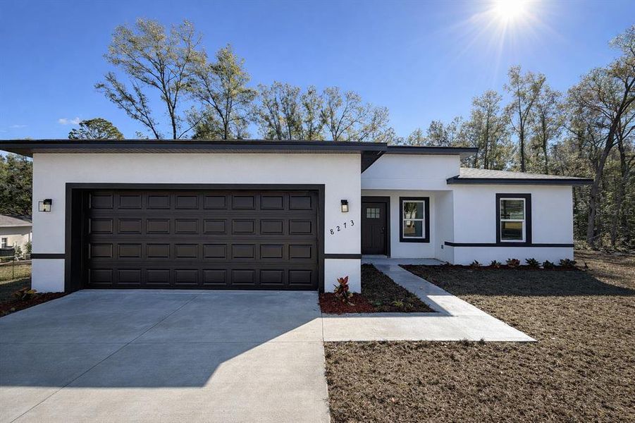 Front exterior of a new home in , Citrus Springs, FL, highlighting curb appeal (Image 1). Front exterior of a new home in , Citrus Springs, FL, highlighting curb appeal (Image 1).