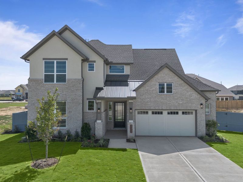 Front exterior of a new home in Fulshear Lakes, Fulshear, TX, highlighting curb appeal (Image 30). Front exterior of a new home in Fulshear Lakes, Fulshear, TX, highlighting curb appeal (Image 30).