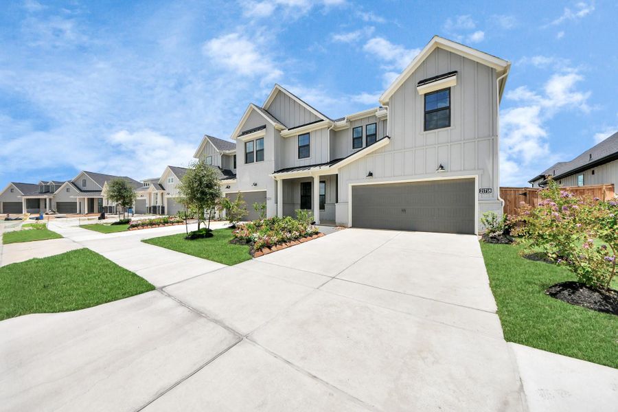 Front exterior of a new home in Bridgeland: Signature Collection, Cypress, TX, highlighting curb appeal (Image 21).