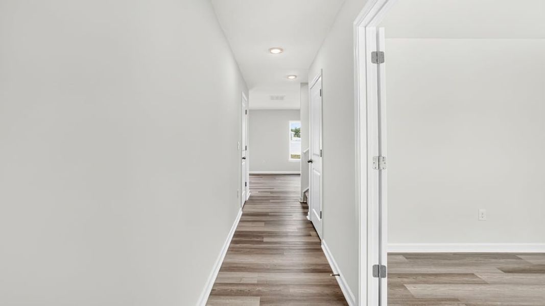 Spacious, unfurnished interior of a new home in Bentley Park, Greenwood (Image 16).