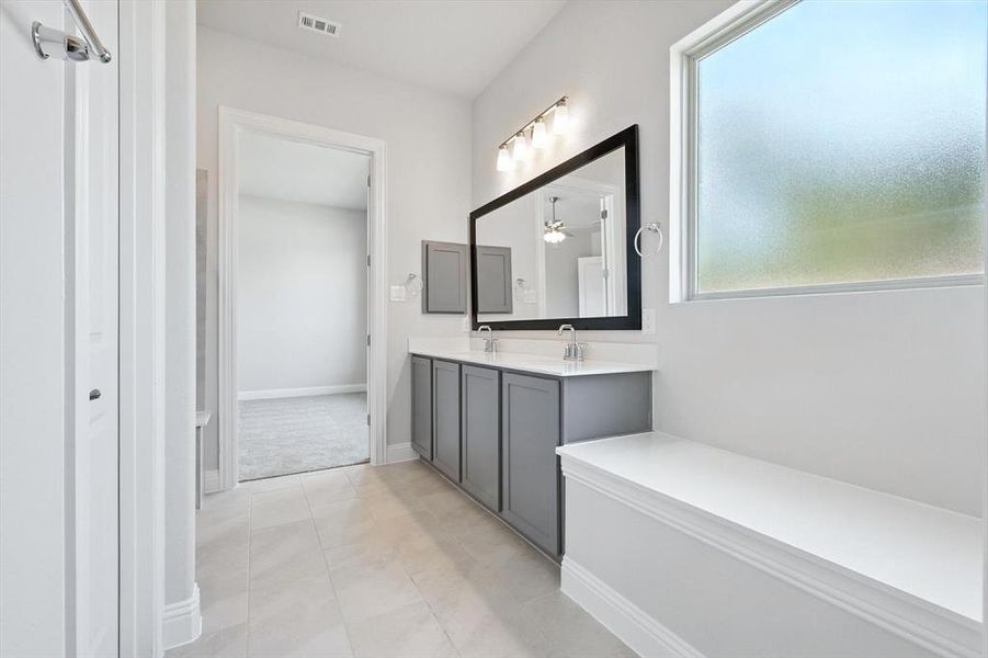 Bathroom with double vanity and tile patterned floors Bathroom with double vanity and tile patterned floors