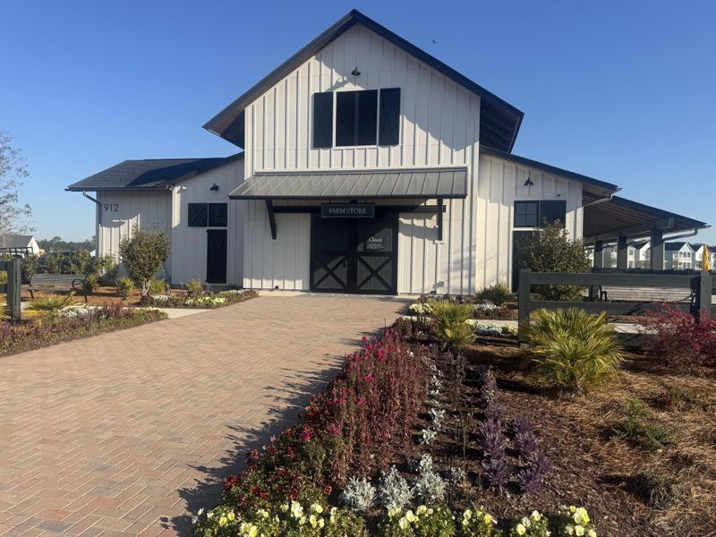 Front exterior of a new home in Carnes Crossroads, Summerville, SC, highlighting curb appeal (Image 22).