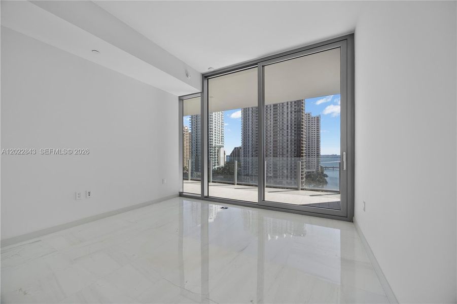 Spacious, unfurnished interior of a new home in Aston Martin Residences, Miami (Image 21).