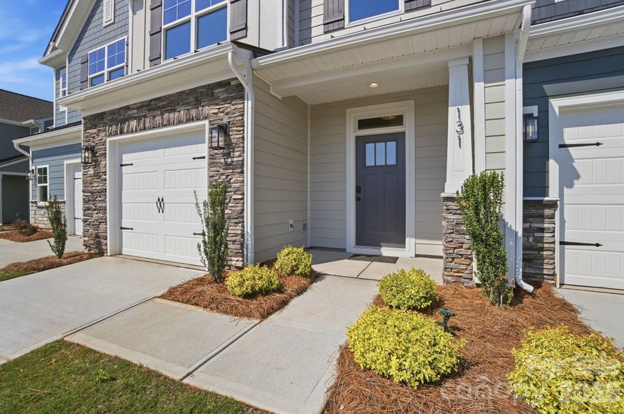 Exterior details and patio area of a home in Blythe Mill Townhomes, Waxhaw (Image 3).