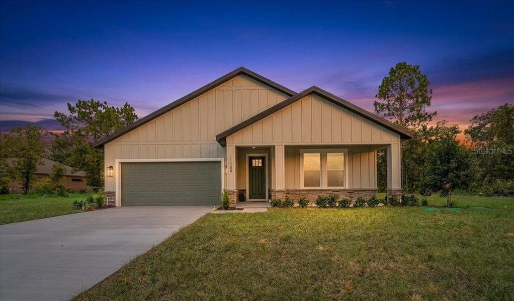 Front exterior of a new home in , Weeki Wachee, FL, highlighting curb appeal (Image 32). Front exterior of a new home in , Weeki Wachee, FL, highlighting curb appeal (Image 32).