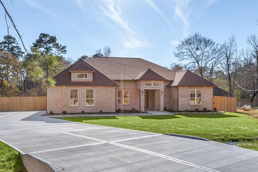 Front exterior of a new home in , Magnolia, TX, highlighting curb appeal (Image 28). Front exterior of a new home in , Magnolia, TX, highlighting curb appeal (Image 28).