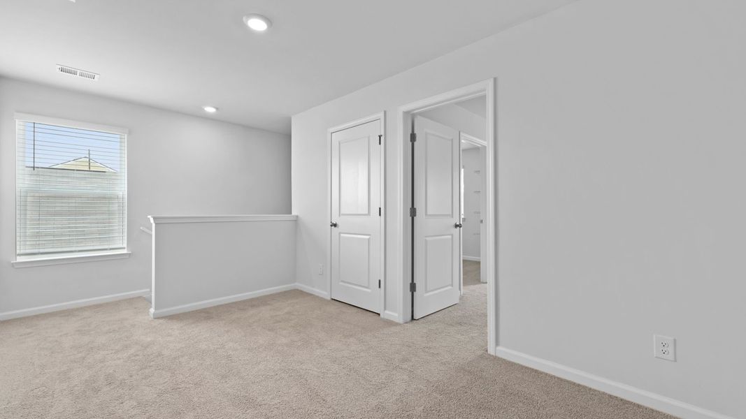 Representative unfurnished interior of a home built from the ROBIE by D.R. Horton in Hillcrest, Ravenel (Image 26).