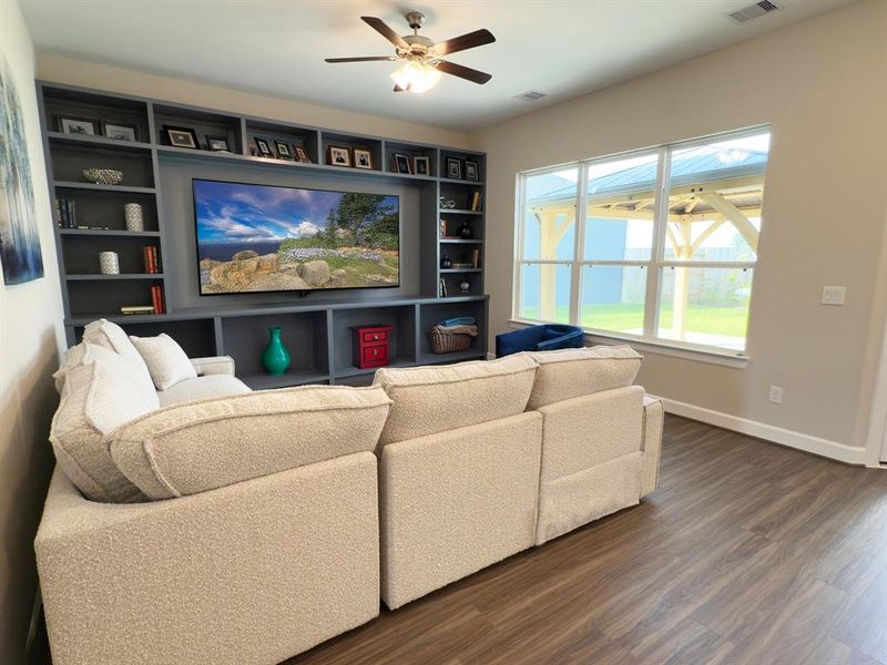 This living Space Features and expansive, light filled area with large windows and a versatile layout perfect for entertaining and everyday living. *Image depicts home as-is with some elements virtually staged. This living Space Features and expansive, light filled area with large windows and a versatile layout perfect for entertaining and everyday living. *Image depicts home as-is with some elements virtually staged.