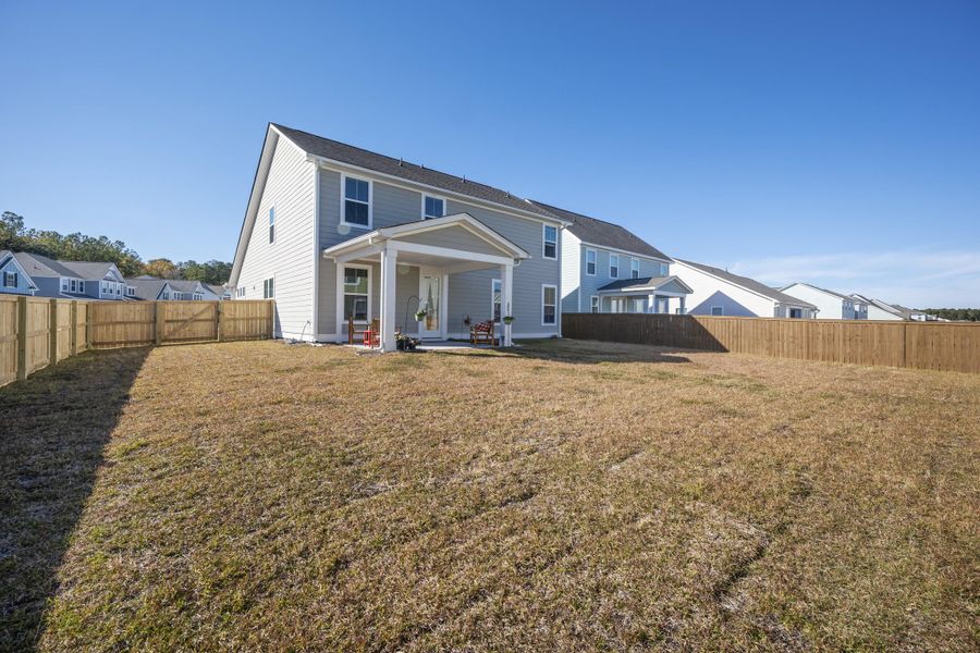 Exterior details and patio area of a home in High Point at Foxbank, Moncks Corner (Image 26).