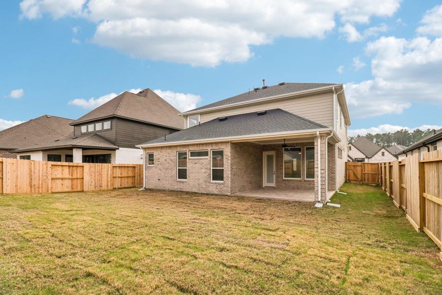 Exterior details and patio area of a home in The Highlands, Porter (Image 20).