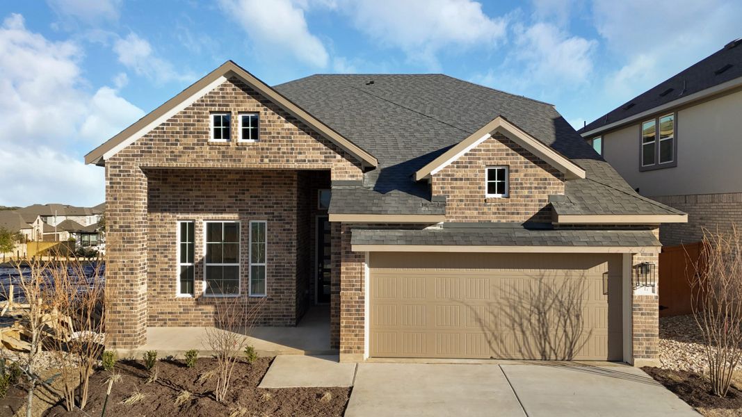 Representative exterior photo of a completed home built from the Peyton by Chesmar Homes in The Grove at Blackhawk, Pflugerville, TX (Image 2).