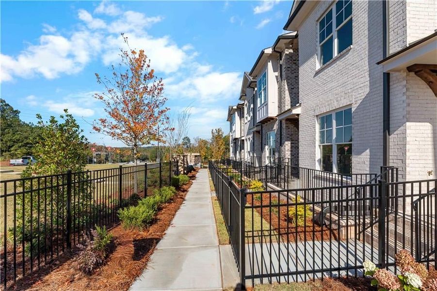 View of community with a fenced front yard and a residential view