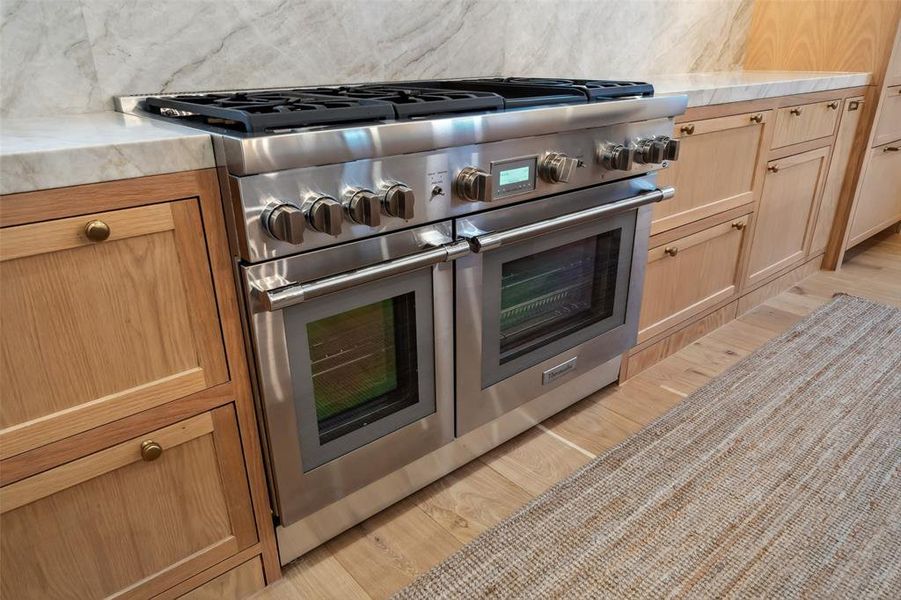 48" Thermador Range with double ovens, 6 burners and griddle accessory