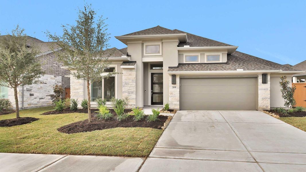 Front exterior of a new home in Marvida 55' - Gated, Cypress, TX, highlighting curb appeal (Image 15). Front exterior of a new home in Marvida 55' - Gated, Cypress, TX, highlighting curb appeal (Image 15).