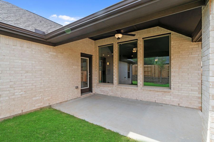 Exterior details and patio area of a home in Wildtree, Magnolia (Image 3).